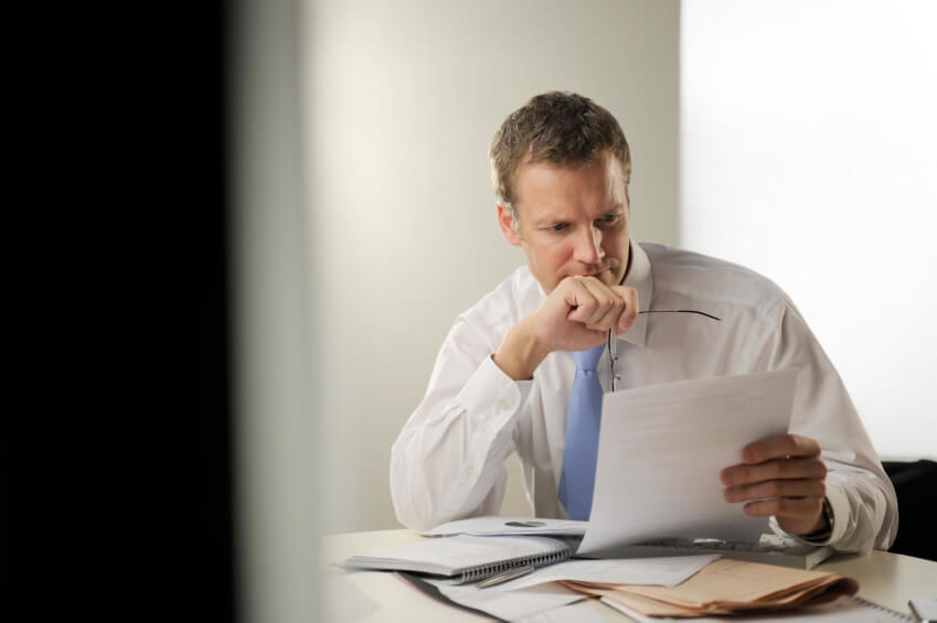 Businessman looking over report