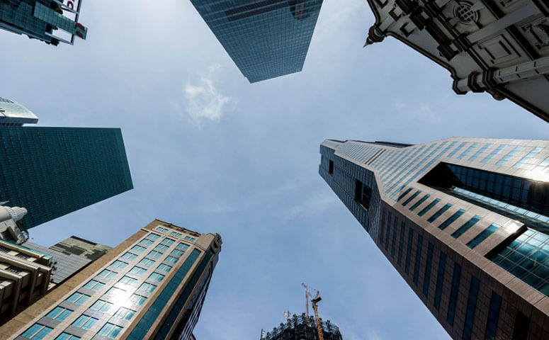 Upward view of several downtown office buildings