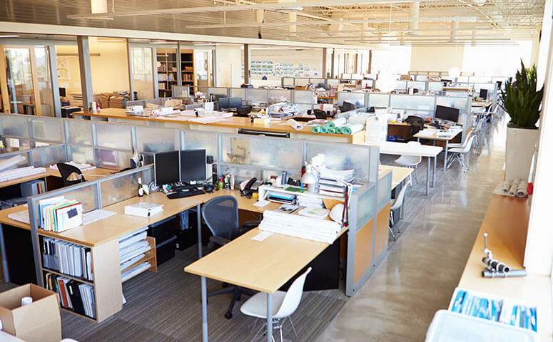 Interior view of office space with many cubicles